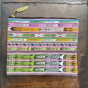 Unique zippered pouch with feather charm pull